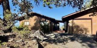Experience comfort in this charming 3 bed, 2 bath rental home with a wood-burning stove, sunken jacuzzi bathtub, and screened back lanai. Your peaceful retreat awaits! Gallery 1