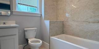 Brand New Construction in Perfect Location!  Laundry in Unit, Centralized Heating and A/C!  Pro Managed! Gallery 7