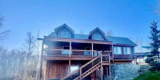 Amazing custom built Alaskan Log home across from Rainbow Lake!  Fully Furnished! Gallery 1