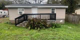 Charming 2BR Home with Large Front Porch & Spacious Kitchen Gallery 1