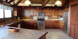 Very private, mostly furnished, rustic Maui Meadows home with large pool, walk around deck with panoramic ocean views. Available for 6 months only. Gallery 11
