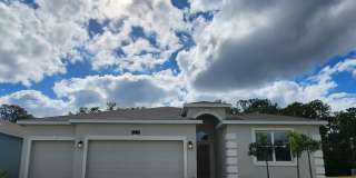 Beautiful Like New One Story Pine Glen Home with Solar Panels for Energy Efficiency & Three Car Garage Gallery 1