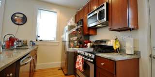 Nicely renovated Townhouse in a prime location near the Green Line with parking included! Gallery 1