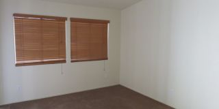 Huge family room with kitchen nicely tucked in the middle. Gallery 8