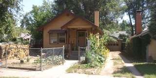 Charming Central Bungalow with Fireplace, Fenced Yard & Oversized Garage! Gallery 1