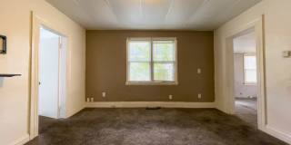 Fall into this cozy 3-Bedroom Home with a fenced in yard & detached garage! Gallery 6