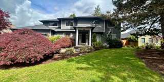 Welcome to this spacious 4-bedroom, 2.5-bathroom home located in Vancouver, WA! Gallery 1
