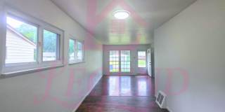 3 Bedrooms | 1 Bathroom | Hardwood Floors | Bright Living/Dining Area | Galley Kitchen | Unfinished Basement for Storage Gallery 1