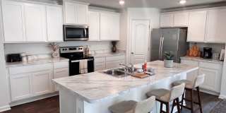 Picturesque Waterfront 4-Bedroom Home with Premium Amenities + 3 Car Garage! Picturesque Waterfront 4-Bedroom Home with Premium Amenities + 3 Car Garage! Gallery 1
