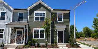 Beautiful 3 Bedroom End Unit Townhome with 2-Car Garage and Loft located in the desirable Royal Creek community in Raleigh! Available on July 05! Gallery 1