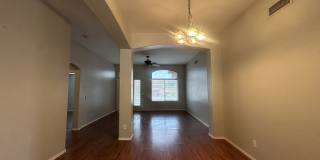 Single-level 3-bedroom home in a desirable Chandler location featuring a 2-car garage and tile roof and wood plank flooring throughout Gallery 12