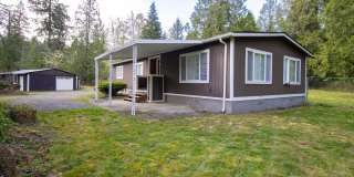 2 Bed / 2 Bath Home with 4-Car Garage, Large Yard & RV Parking in Graham! Gallery 1