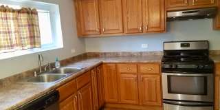 Cozy 3 bedroom 1.5 Bathroom Townhouse! Hardwood Throughout! Parking Included In Rent! Available for a June Move In! Gallery 4