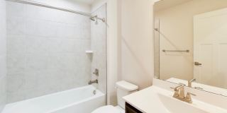 Welcome to this beautifully designed 3 level townhome in Westphalia Town Center Community! Gallery 26