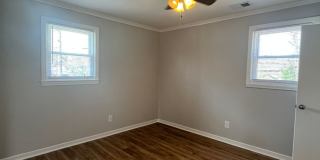 Travelers Rest !! 3 BR, 2 BA with Great Living Space - Den, Bonus Room, Primary Suite has a HUGE walk in Closet, Laundry Room, private screened in porch & deck AND a storage shed out back.  Fresh Paint and New LVP Floors Gallery 17