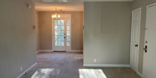 This residence showcases a beautifully updated kitchen with a sleek modern-contemporary aesthetic. Gallery 4
