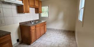 AFFORDABLE 2BR SINGLE FAMILY HOME, HARD SURFACE FLOORS, STAIR LESS, SIDE DRIVE, GARAGE Gallery 1