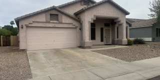 Single-level 3-bedroom home in a desirable Chandler location featuring a 2-car garage and tile roof and wood plank flooring throughout Gallery 1