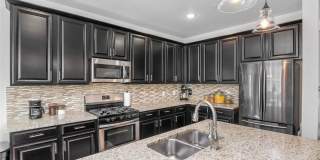 Like new gorgeous ground level Condo with Detached Garage and open floor plan. Gallery 7