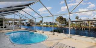 Beautiful canal front home with dock! Gallery 19