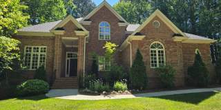 Custom Brick Home on Private Wooded Lot in Cary's Prestigious Wessex Community Gallery 1