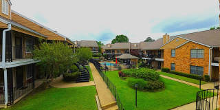 Get ready to fall in love with comfortable, carefree living at Courtyard Condominiums in Tyler, TX! Gallery 1