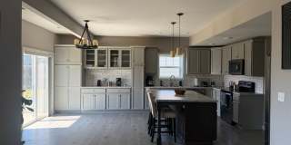 Spacious 4-Bedroom, 2.5-Bathroom 1.5-Story Home with 3-Car Garage Gallery 1