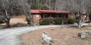 $1,100 - 2 Bedroom / 1 Bath Partially Furnished Log Cabin Near Cherokee Gallery 1