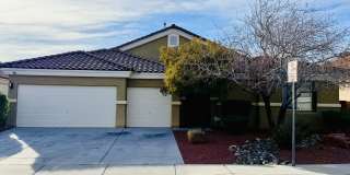 Welcome to this stunning 5-bedroom, 3-bath home located in the desirable Estates of Wigwam Ranch community! Gallery 1