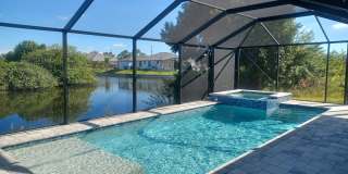 Available Now: Pool Home Overlooking a Canal 3 BR / 2 BA Gallery 1