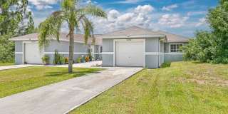 Well Maintained Duplex in Lehigh with 1 Car Garage! Gallery 1