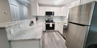 RENOVATED 3/2 w/ Den, Granite Counters, Stainless Appliances, Washer/Dryer, & Plank Vinyl Floors! Furnished or Unfurnished, Inc Lawn Maint! Avail NOW for $1775/month! Gallery 5