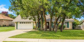 Spacious 3/2 Rental in North East Independent School District with Stone Fireplace, Covered Patio & Mature Trees!  Conveniently located near shopping, restaurants, Comanche Lookout Park, Loop 1604, Nacogdoches Rd, Ft. Sam and Randolph AFB. Gallery 1