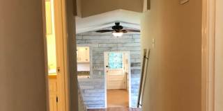 Travelers Rest !! 3 BR, 2 BA with Great Living Space - Den, Bonus Room, Primary Suite has a HUGE walk in Closet, Laundry Room, private screened in porch & deck AND a storage shed out back.  Fresh Paint and New LVP Floors Gallery 12