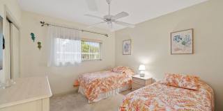 first-floor unit featuring a 2 bedroom, 2 bath fully furnished Gallery 12