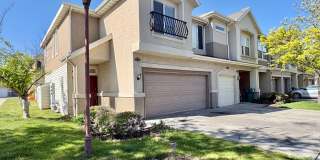 Spacious 3 Bed Townhome in West Valley City with Gated Yard, Garage & Pool Gallery 1