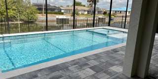 Brand-New Waterfront Luxury in Cape Coral | Heated Pool, Spa, Outdoor Kitchen & 3-Car Garage Gallery 35