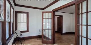 Large main floor duplex unit, Updated Kitchen & Bath, Full Dining Room w/Built-ins + Sunroom, garage stall Gallery 5