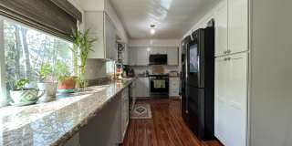 Comfortable Living in Bethany with Two Separate Units, Expansive 0.45-Acre Lot & Versatile Detached Shop Gallery 6