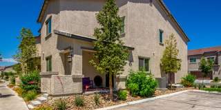 Beautiful corner lot townhome with custom paint, plentiful community green spaces. Gallery 1