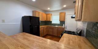 Charming 3BR Home w/ Hardwood Floors, Large Kitchen & Private Fenced Yard Gallery 4