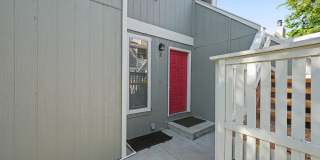 Spacious 2BR/2BA Corner Unit with Finished Basement, Private Patio & Garage Gallery 1