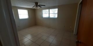 JUST REDUCED!!! 2/1.5/1 1000 Sq. Ft. NEW AC!!!Spacious living room, Lanai, fenced in yard, and tile floors thoughout! Gallery 8