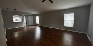 RESERVE AT WEDGEFIELD 3 bedroom 2 bath home with stainless appliances, laminate flooring and a fenced back  yard! Gallery 14