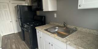 2 Bedroom + Den Home with Porch, Fenced Yard, and Water Included on Barclay Street Gallery 14