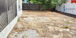 Beautiful 2/2/1 1150 Sq. Ft. with BONUS ROOM!!... tile & luxury plank flooring, Frest paint and a large fenced in yard! Gallery 23