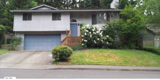 Sweet and spacious home in Beaverton with a garage and large fenced yard available now! Sweet and spacious home in Beaverton with a garage and large fenced yard available now! Gallery 1