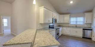 Fall in love with this stunning 4-bedroom, 3-bathroom full-brick ranch home Gallery 1