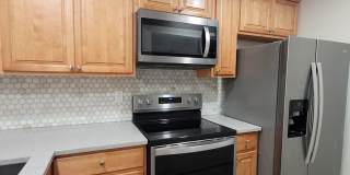 Light & bright and move in ready, updated townhome in Oakwood Villas. Gallery 7