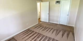2BR/1BA Lakeside ground floor condo with 1 car detached garage, 1 uncovered parking space & community pool. Gallery 12